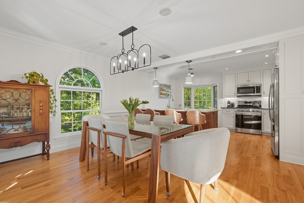 32 Windpath East, Unit 32 West Springfield, MA 01089 - Photo 15 of 40 a view of a dining room with furniture window and wooden floor