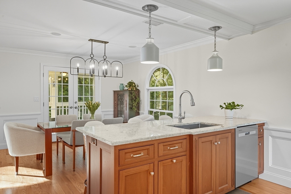 32 Windpath East, Unit 32 West Springfield, MA 01089 - Photo 17 of 40 a dining table with chairs and chandelier