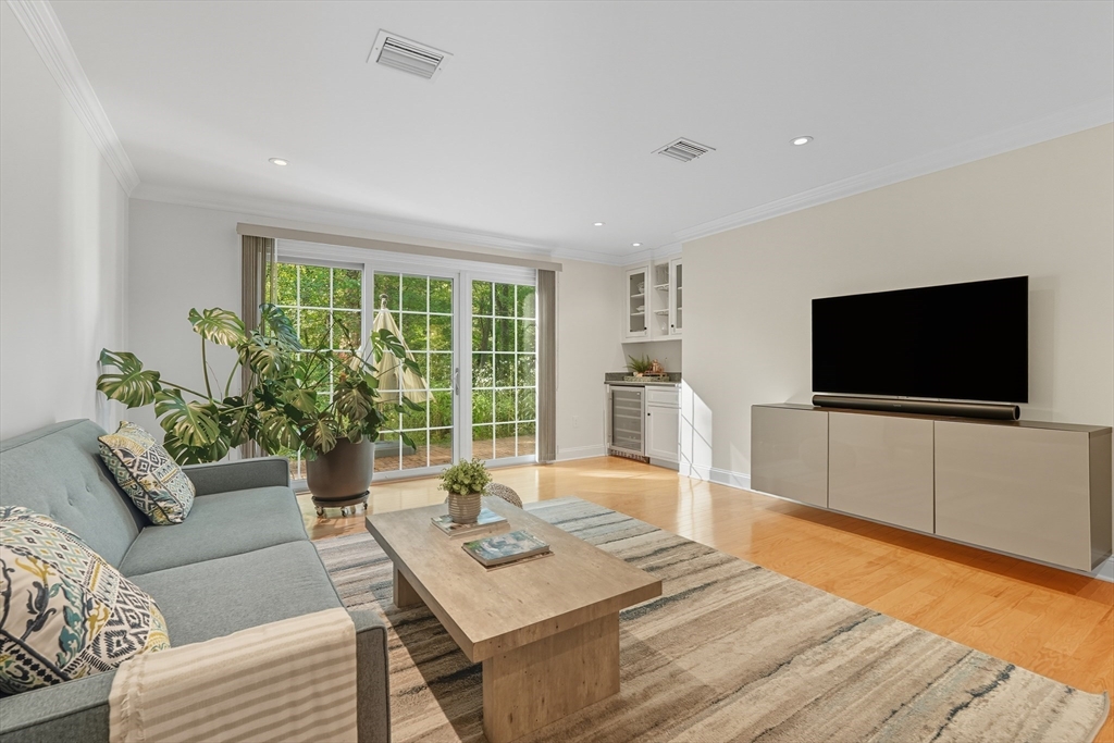 32 Windpath East, Unit 32 West Springfield, MA 01089 - Photo 30 of 40 a living room with furniture and a flat screen tv
