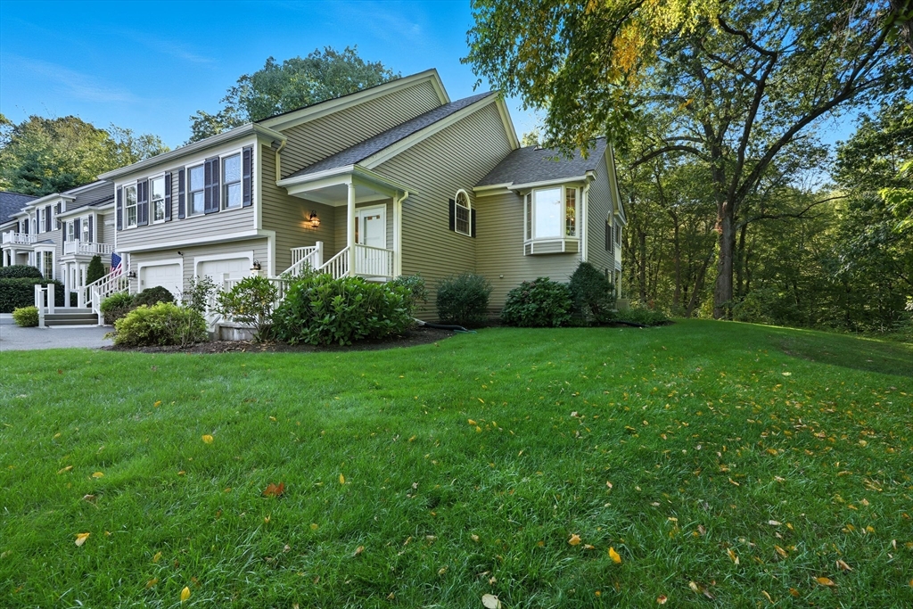 32 Windpath East, Unit 32 West Springfield, MA 01089 - Photo 35 of 40 a view of a house next to a big yard and large trees