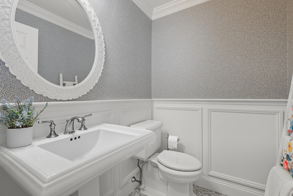 32 Windpath East, Unit 32 West Springfield, MA 01089 - Photo 10 of 40 a bathroom with a sink mirror and toilet