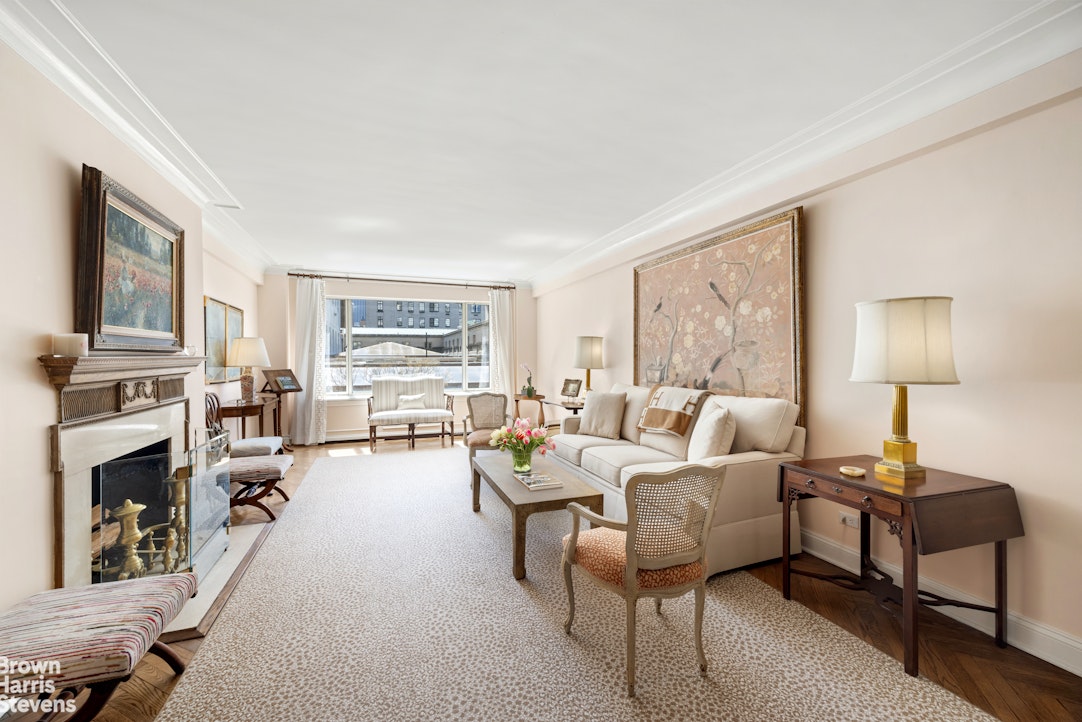 3 East 71st Street, Unit 5A Manhattan, NY 10021 - Photo 2 of 8 a living room with furniture fireplace and a window