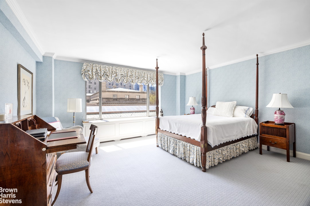 3 East 71st Street, Unit 5A Manhattan, NY 10021 - Photo 3 of 8 a bedroom with a bed and a desk