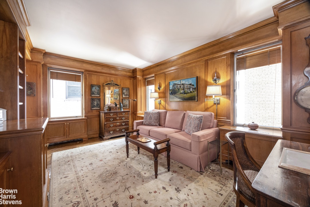 3 East 71st Street, Unit 5A Manhattan, NY 10021 - Photo 4 of 8 a living room with furniture and a window