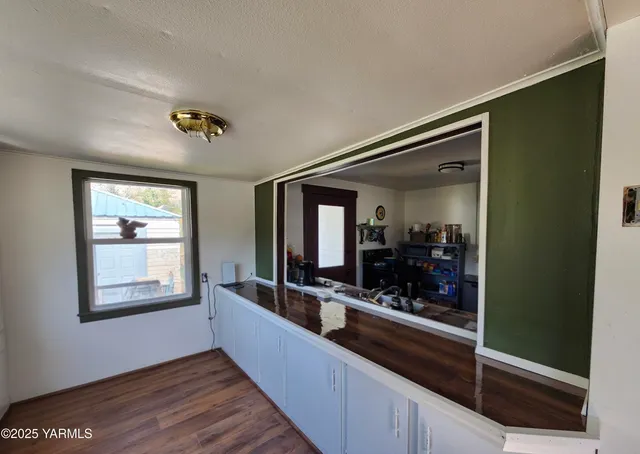 workspace with wooden floor and windows
