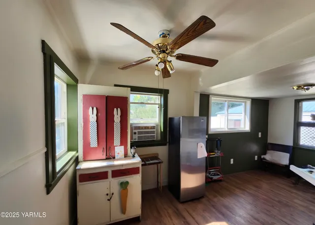 a view of a livingroom with furniture and a window