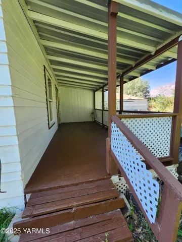 a view of a patio with wooden floor