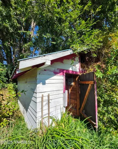 a view of a room with wooden walls