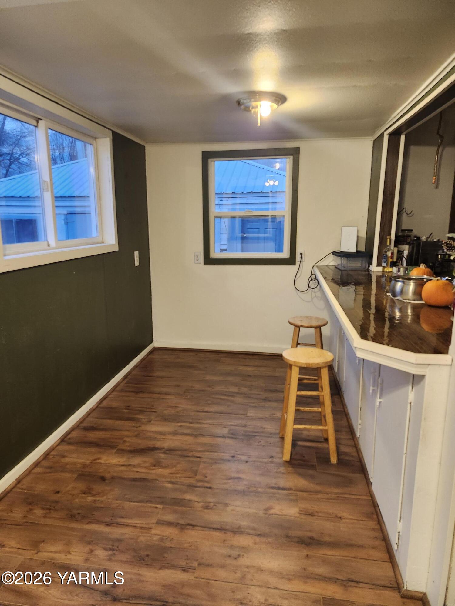 11271 Highway 12 Naches, WA 98937 - Photo 8 of 14 a view of an empty room with wooden floor and a window