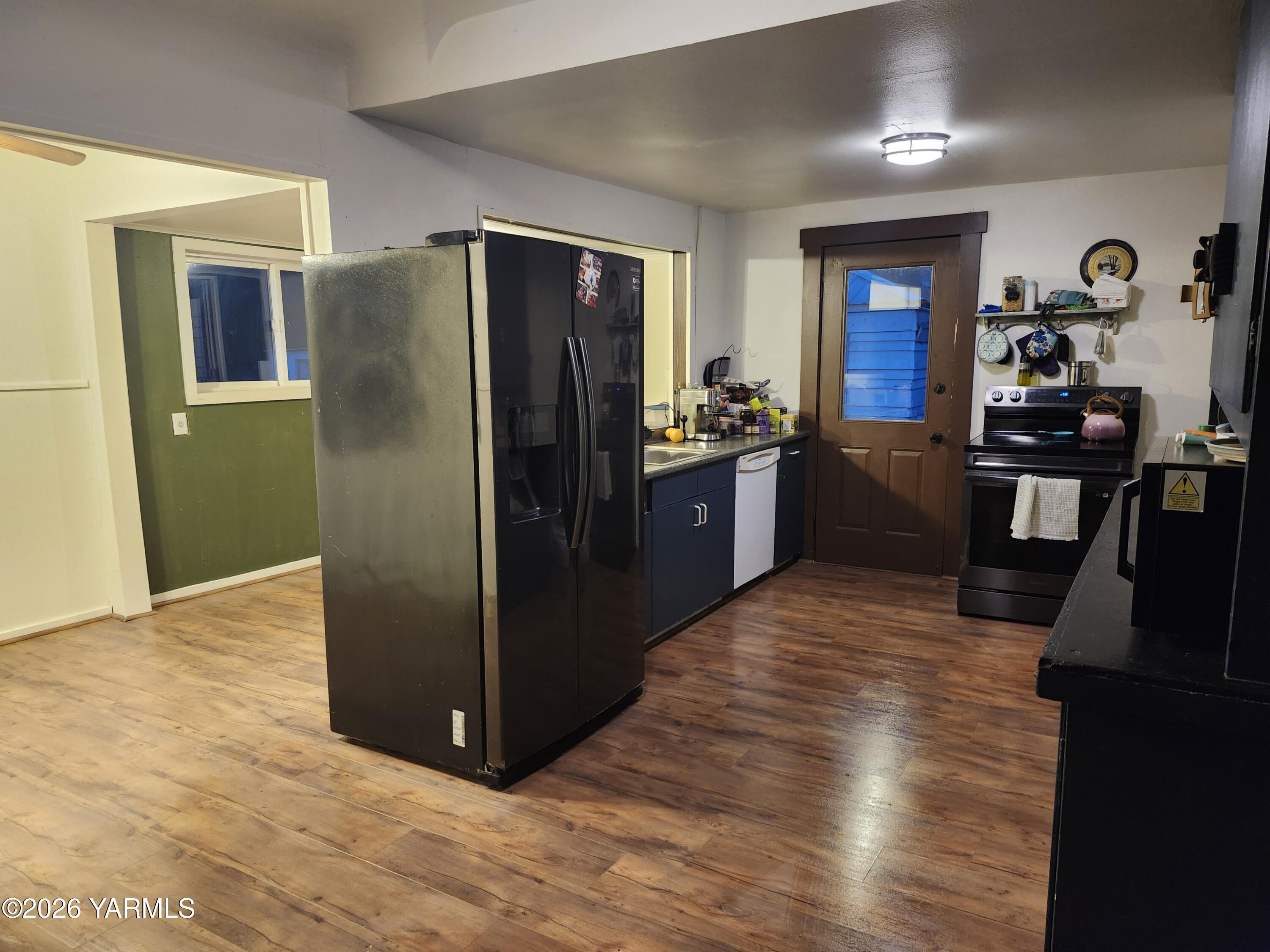 11271 Highway 12 Naches, WA 98937 - Photo 9 of 14 a kitchen with stainless steel appliances granite countertop a refrigerator and a sink