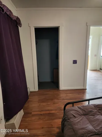 a bedroom with a bed and a mirror