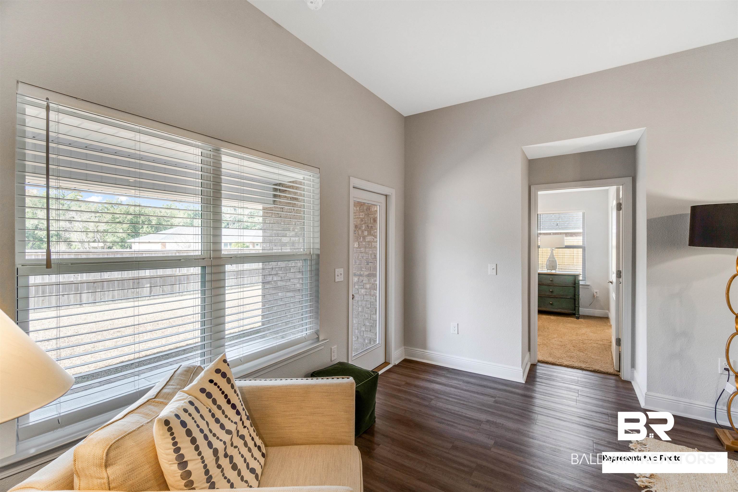 643 Mayflower Drive Foley, AL 36535 - Photo 23 of 34 Living area featuring baseboards and wood finished floors