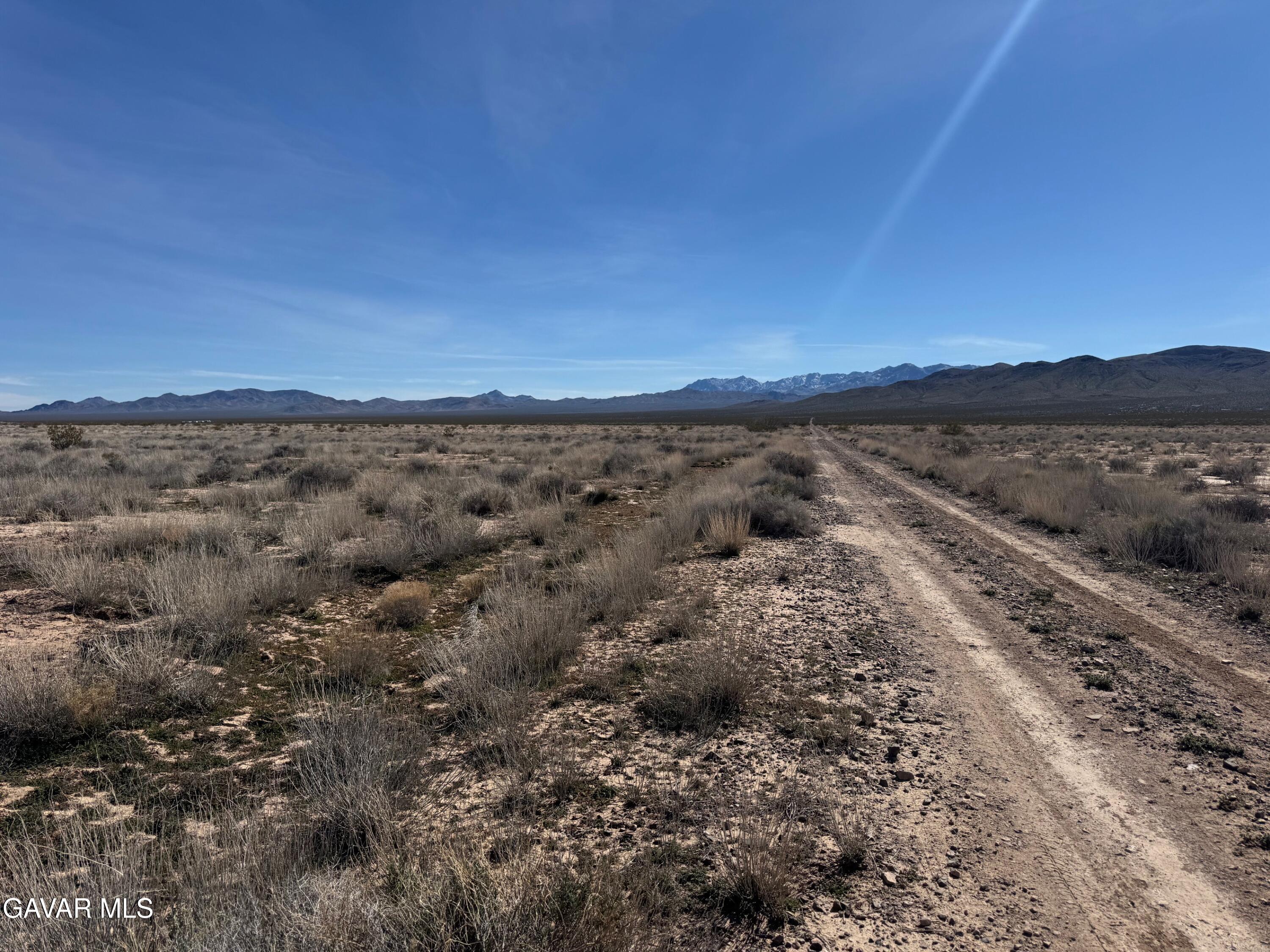 Deming Way South Tecopa, CA 92389 - Photo 2 of 8 a view of a dry yard with wooden floor and mountain view