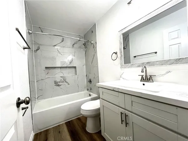 a bathroom with a sink a toilet and a bathtub