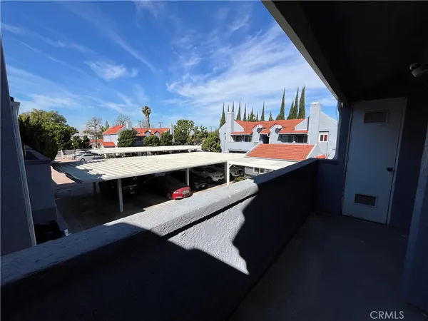 a room with stainless steel appliances kitchen island granite countertop a sink dishwasher stove and cabinets