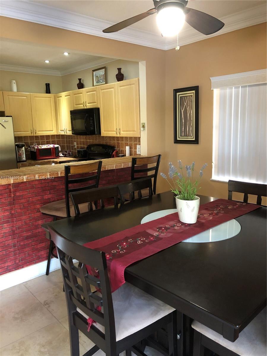 Monarch Lakes Miramar, FL 33027 - Photo 11 of 31 a view of a dining room with furniture
