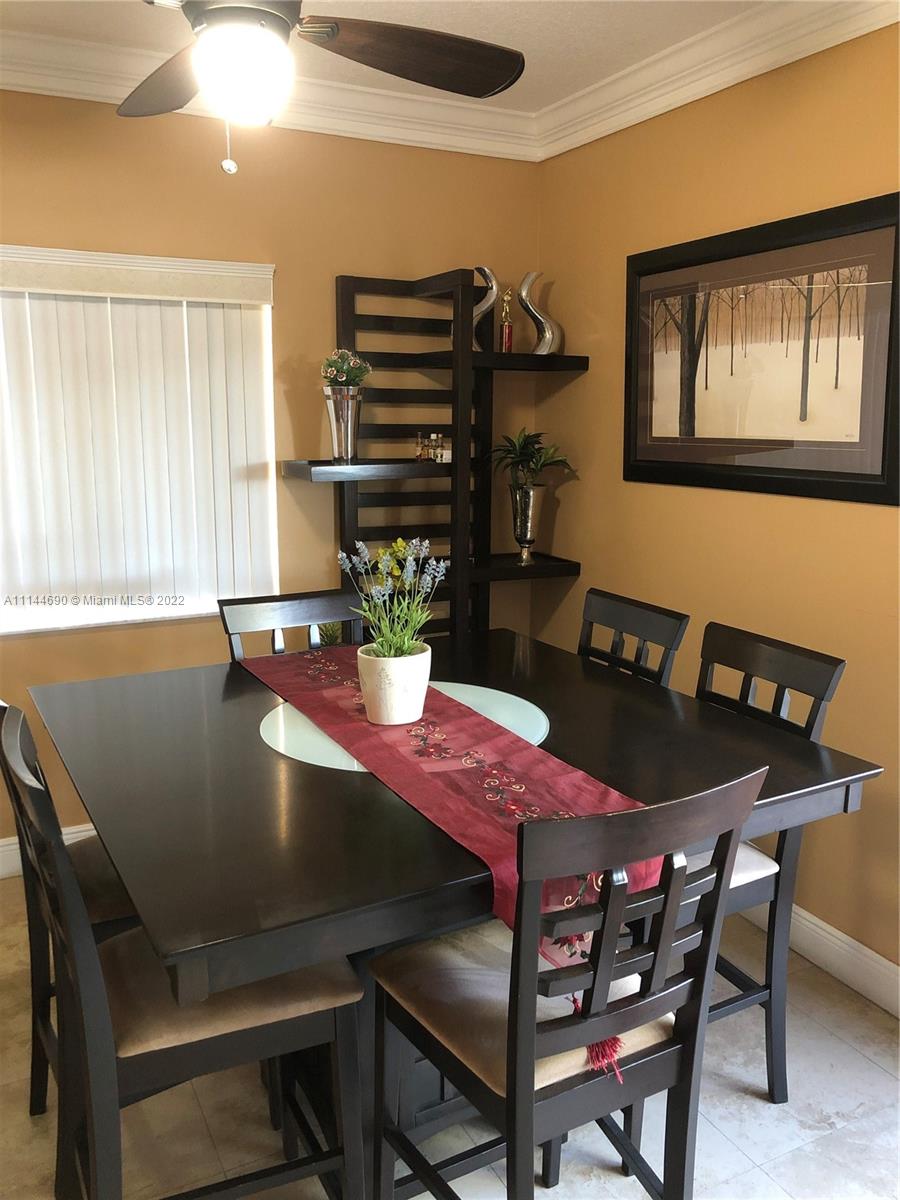 Monarch Lakes Miramar, FL 33027 - Photo 12 of 31 a view of a dining room with furniture and window