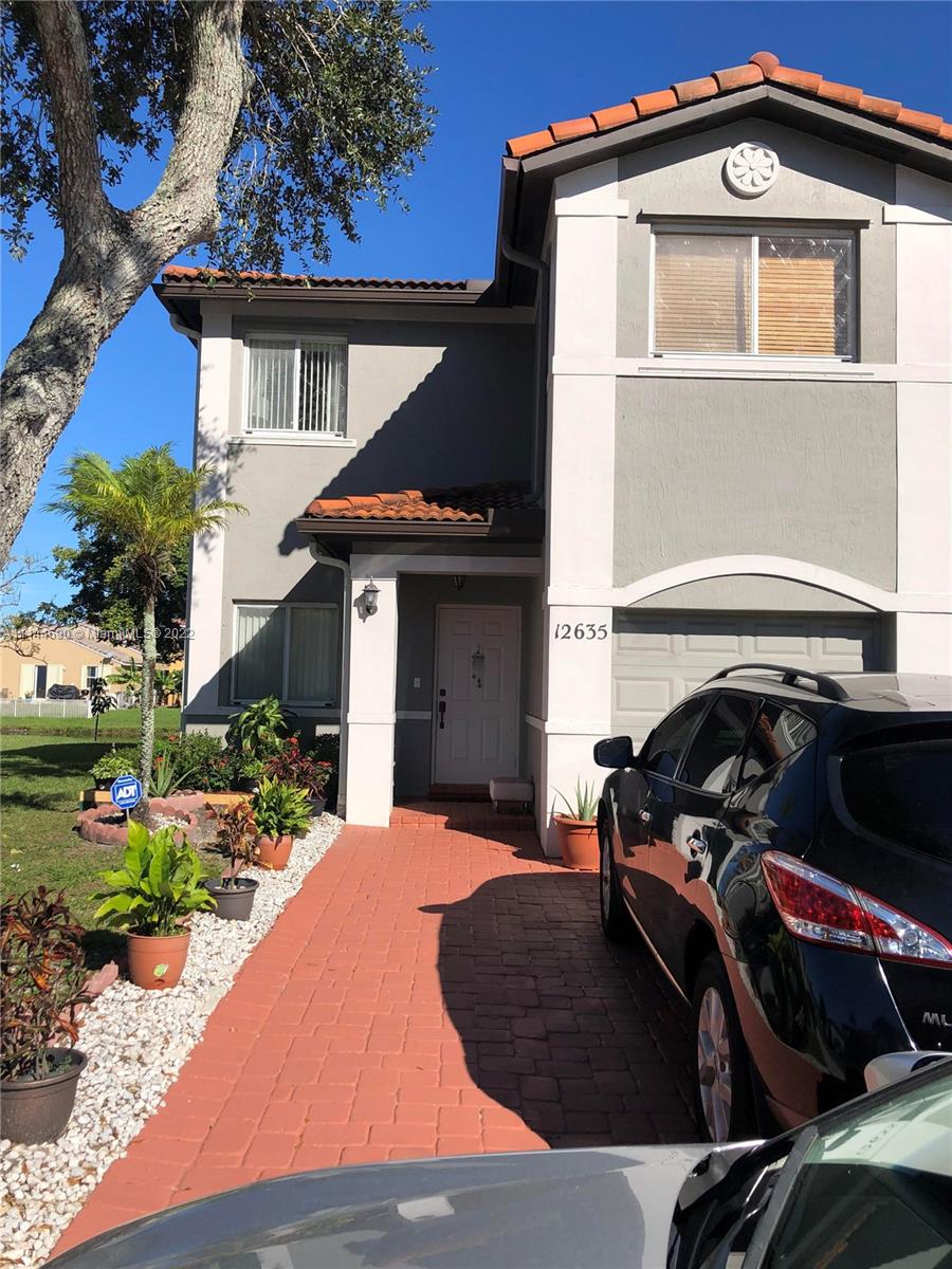 Monarch Lakes Miramar, FL 33027 - Photo 2 of 31 a front view of a house with a yard