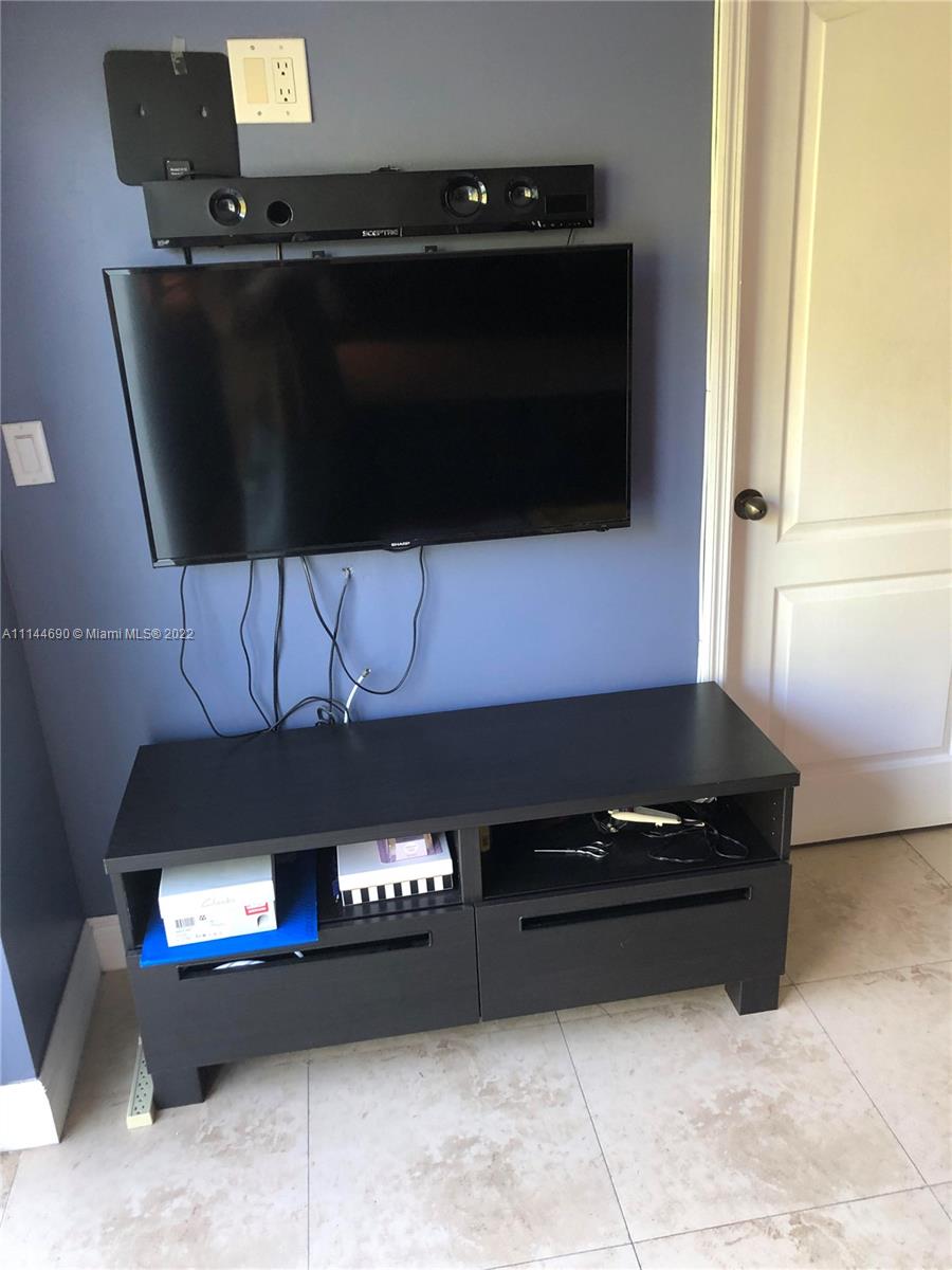 Monarch Lakes Miramar, FL 33027 - Photo 22 of 31 a kitchen with a stove and a microwave