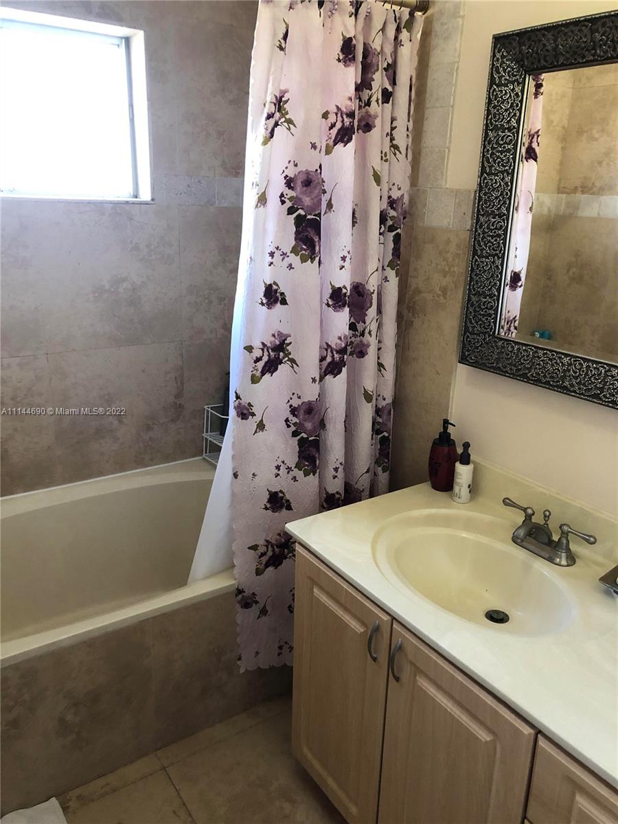 Monarch Lakes Miramar, FL 33027 - Photo 25 of 31 a bathroom with a sink and a bathtub