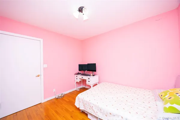 a bed room with a bed and a flat screen tv