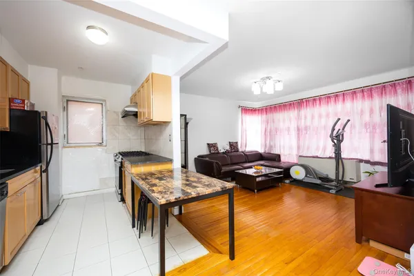a bedroom with furniture and a flat screen tv