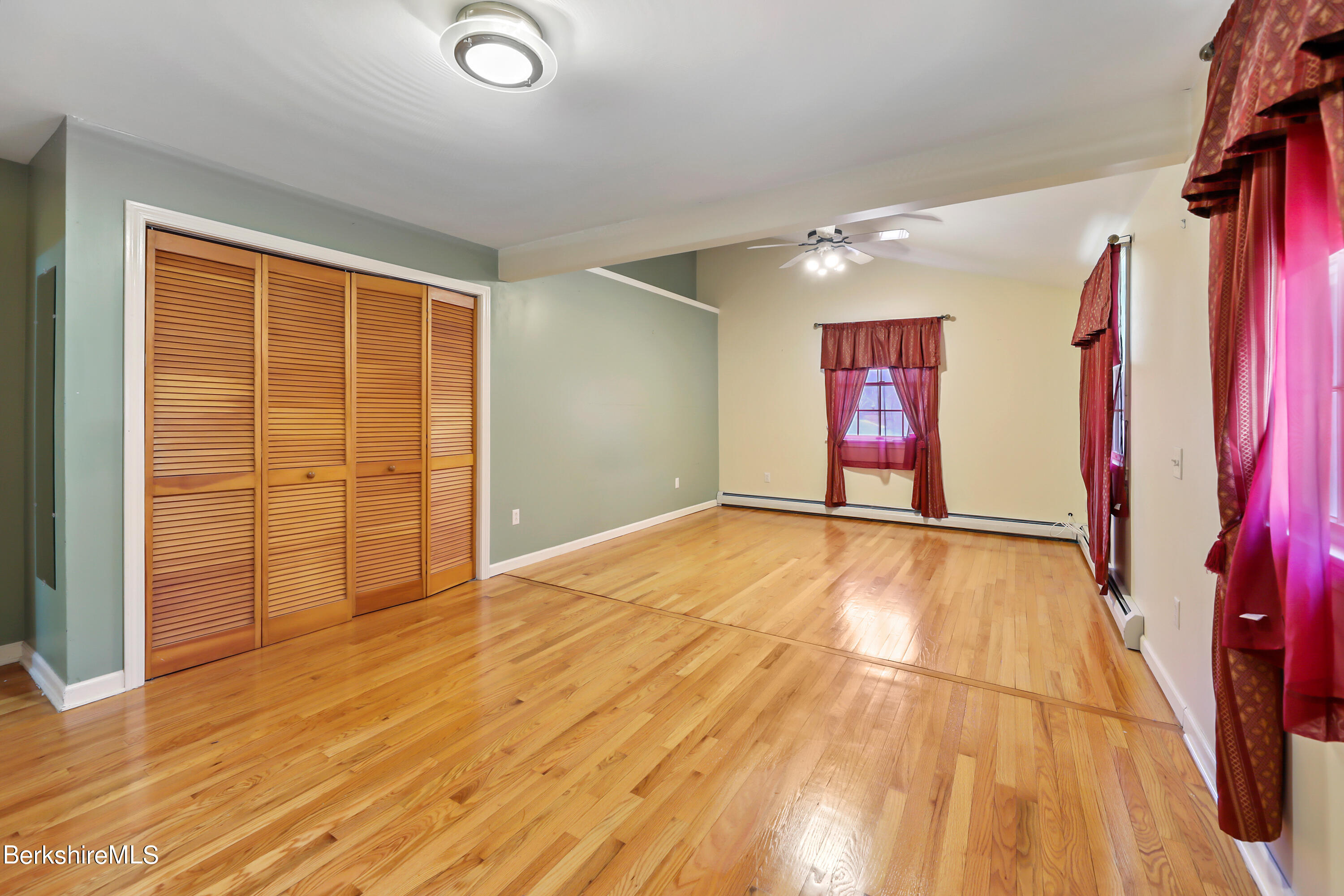 31 Olsen Road Lanesborough, MA 01237 - Photo 15 of 31 an empty room with wooden floor and windows