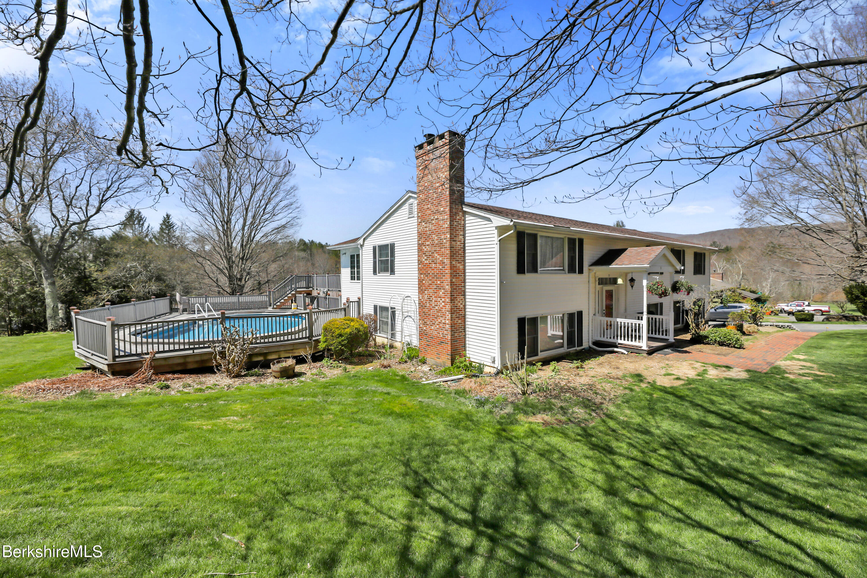 31 Olsen Road Lanesborough, MA 01237 - Photo 2 of 31 a view of a house with backyard and sitting area