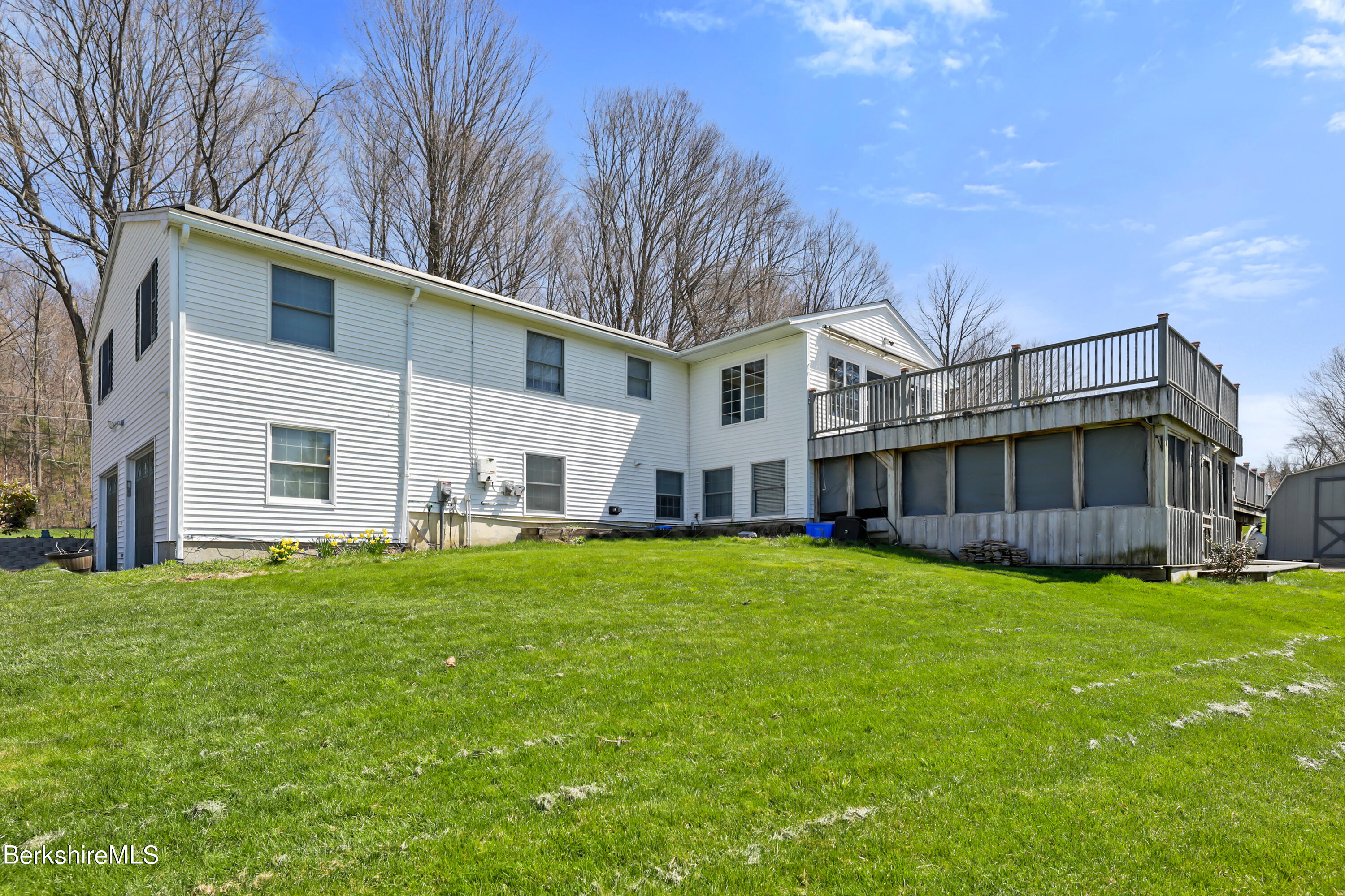 31 Olsen Road Lanesborough, MA 01237 - Photo 29 of 31 a view of a house with a big yard with large trees and a small barn