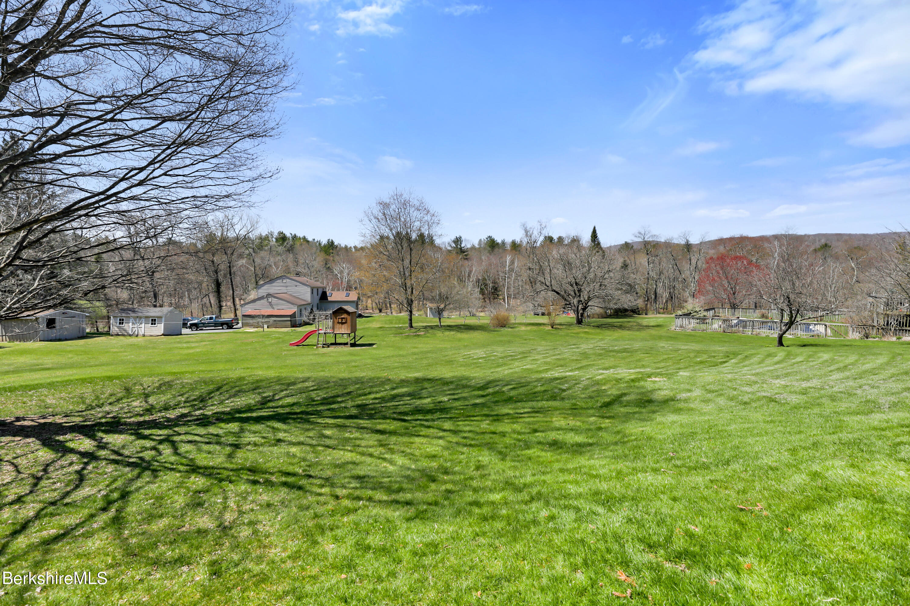 31 Olsen Road Lanesborough, MA 01237 - Photo 30 of 31 a large green field with lots of trees in the background