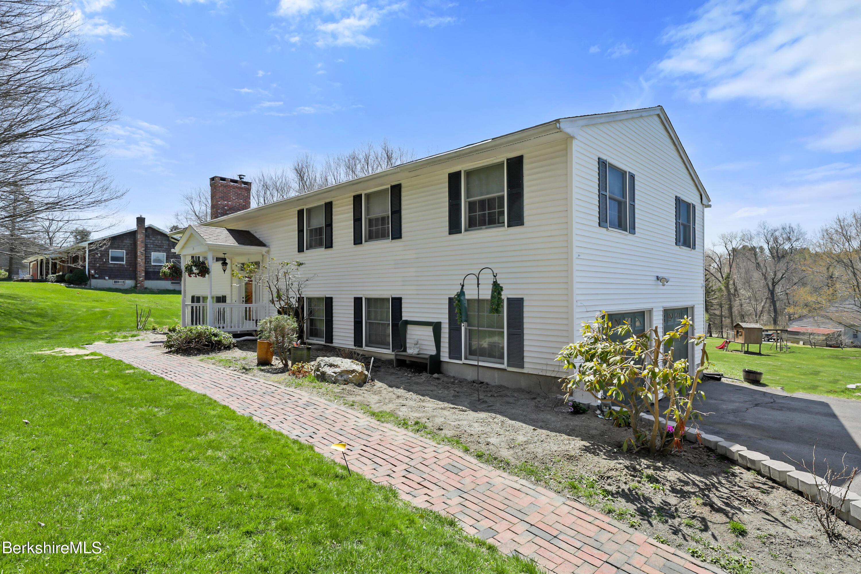 31 Olsen Road Lanesborough, MA 01237 - Photo 3 of 31 a front view of a house with garden