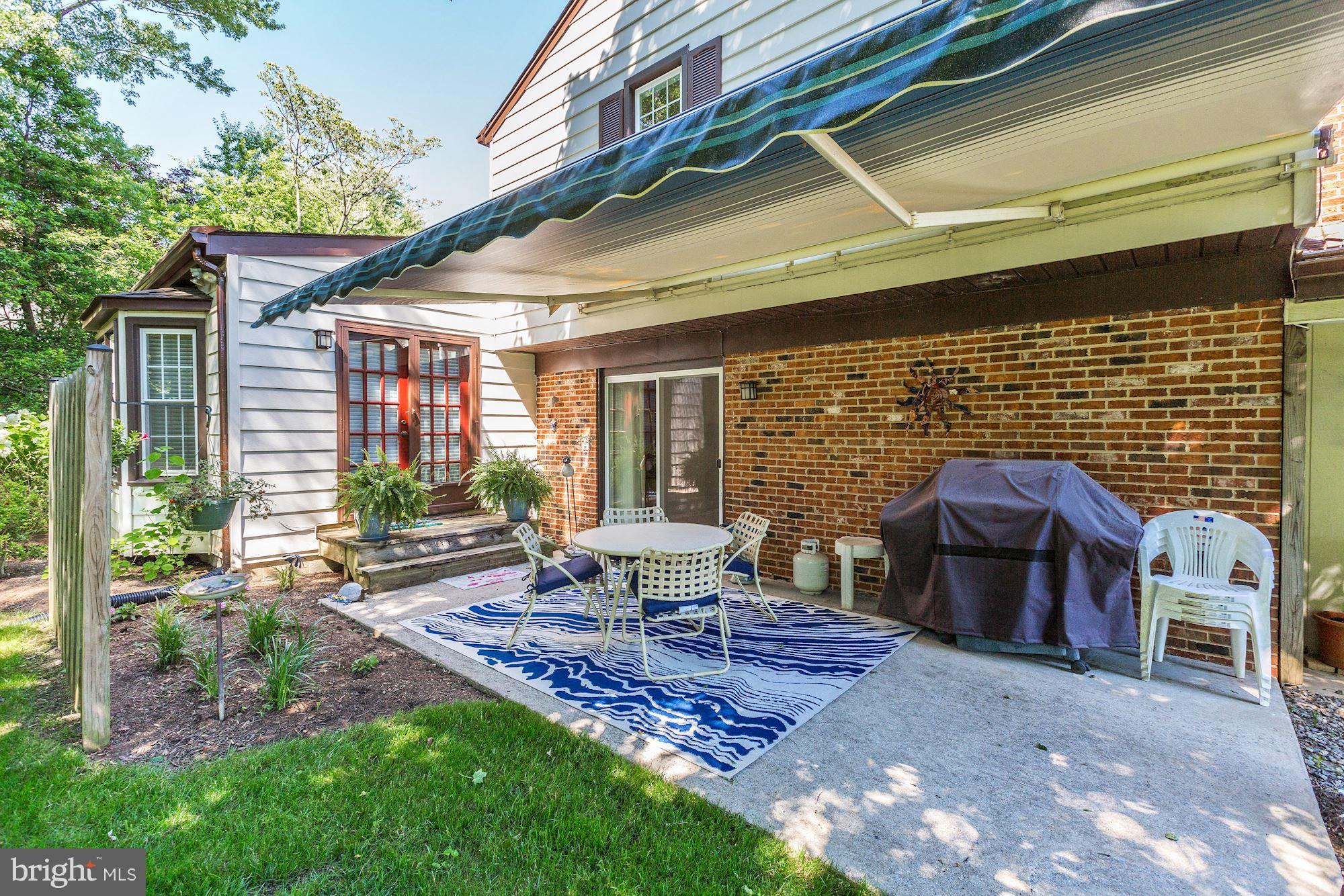 14900 Notley Road Silver Spring, MD 20905 - Photo 26 of 30 PRIVATE PATIO W SUN-SETTER AWNING, DRS TO WORKSHOP