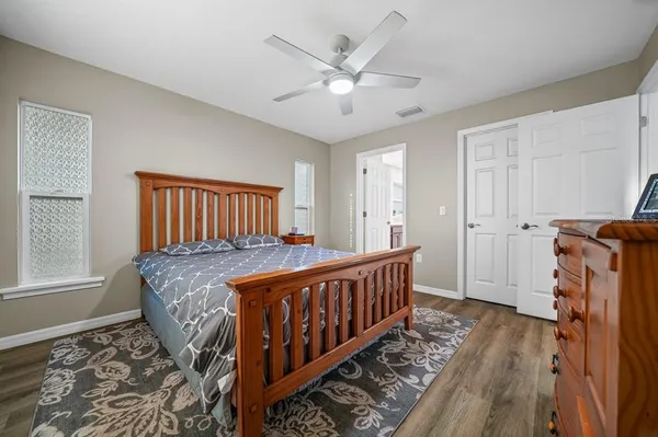 a bed room with a bed and a window