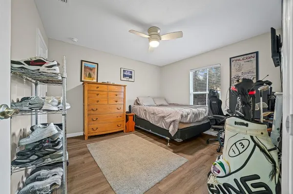 a bedroom with a bed and a tv on table