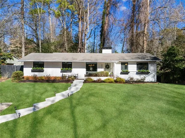 front view of a house with a yard