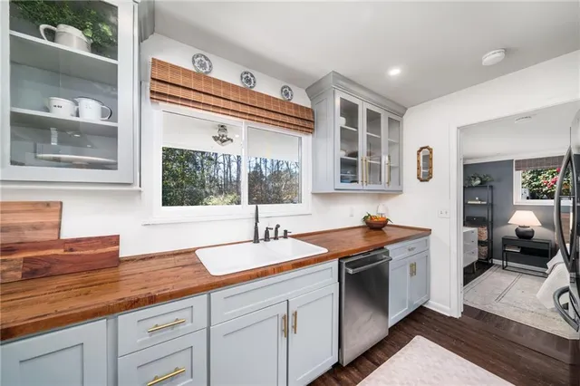 a kitchen with a sink and cabinets
