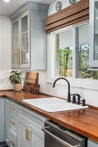 a stove top oven sitting inside of a kitchen
