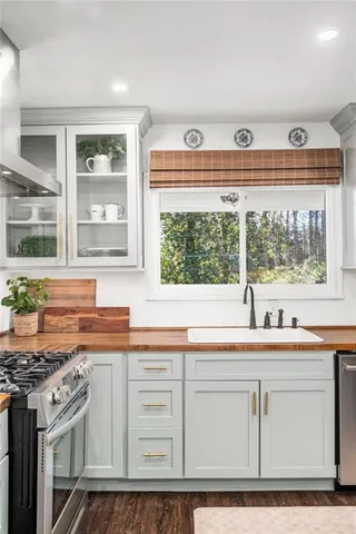 a spacious bedroom with a bed and ceiling fan