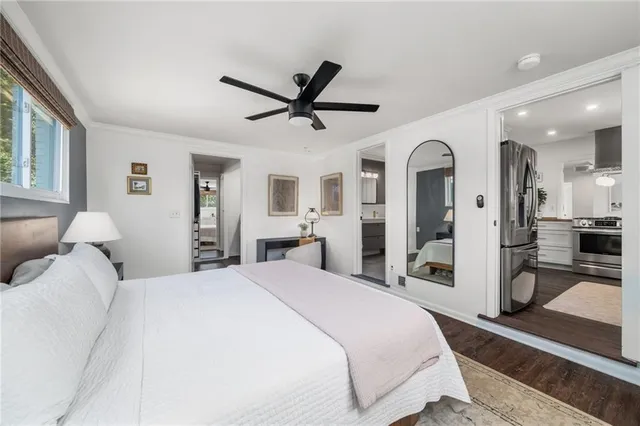 a bedroom with bed furniture and window