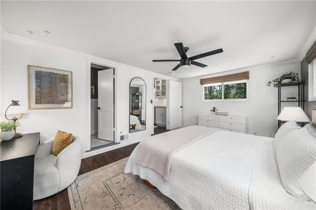a utility room with cabinets washer and dryer