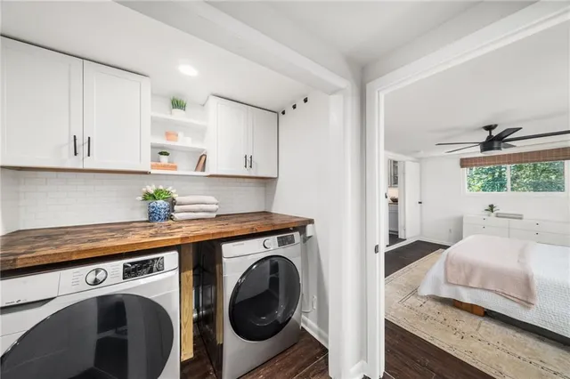 a bathroom with a sink mirror and toilet