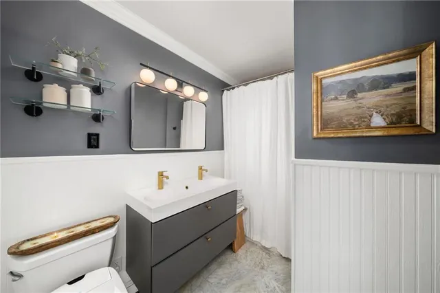 a view of a livingroom with furniture wooden floor and a chandelier