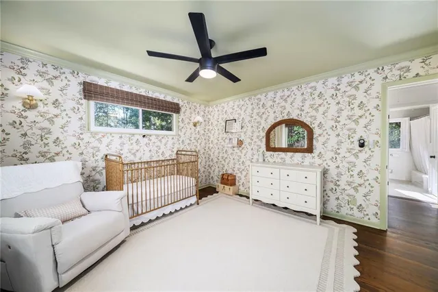 a bathroom with a toilet a sink and a mirror