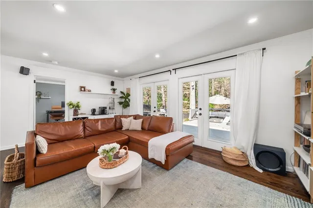 a living room with furniture and flat screen tv