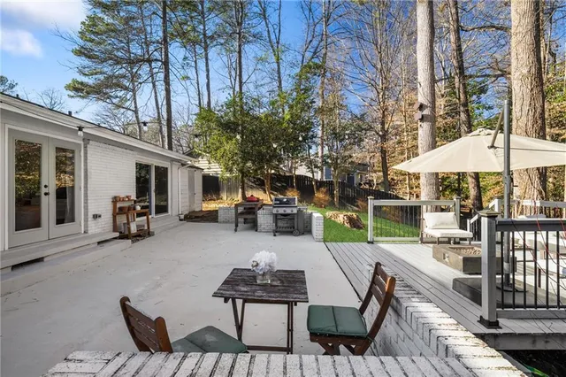 a view of roof deck with furniture