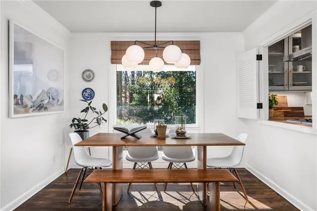 a view of a dining room with furniture window and wooden floor