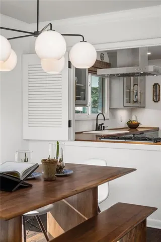 a kitchen with a sink cabinets and window