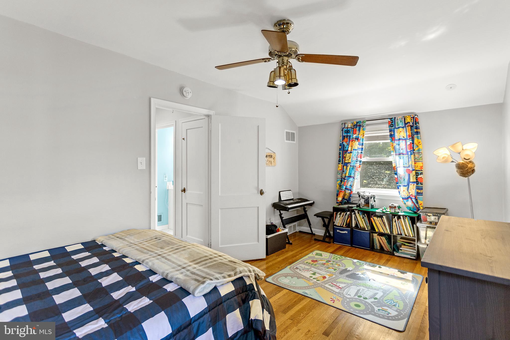 1806 Earlington Road Havertown, PA 19083 - Photo 14 of 27 a bedroom with a bed and a table in it
