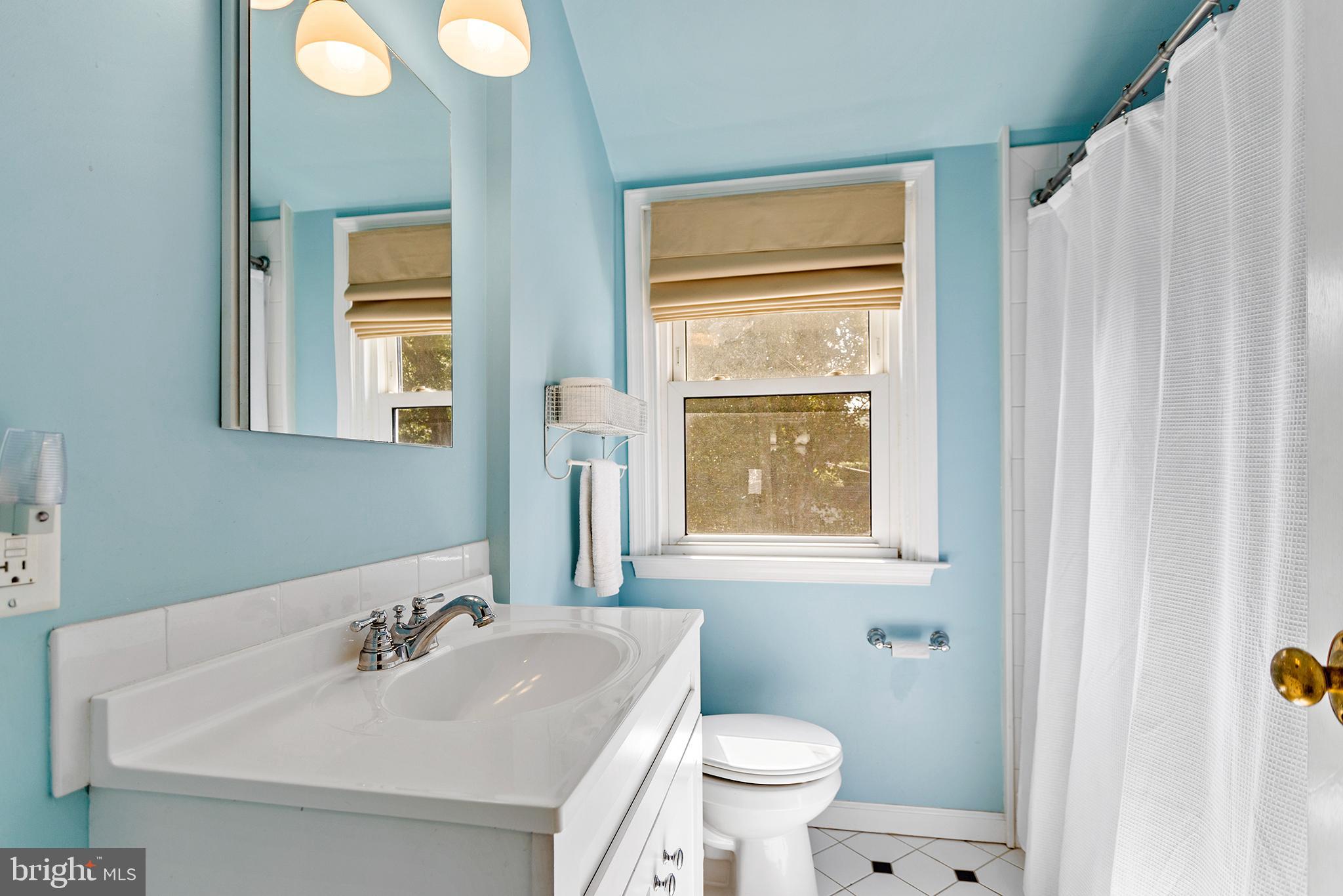 1806 Earlington Road Havertown, PA 19083 - Photo 15 of 27 a bathroom with a granite countertop sink toilet and mirror