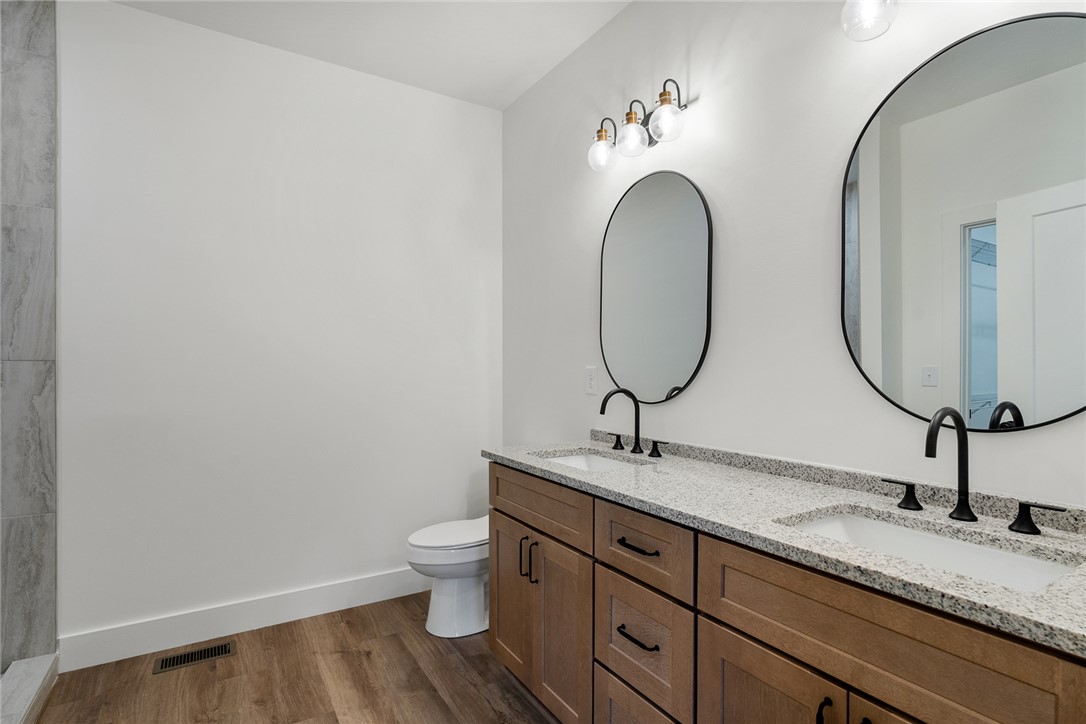125 Cambridge Lane Pendleton, SC 29670 - Photo 12 of 22 This sleek bathroom features a double vanity with modern fixtures and ample storage.